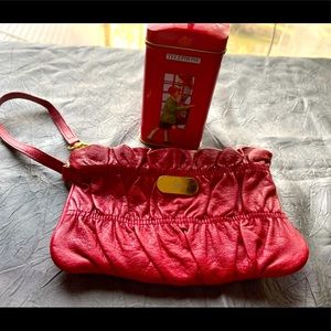 JM wrist wallet to cary your items if you don’t want to bring your bag.